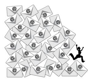 A woman runs from a mountain made of envelopes symbolizing an overload of email